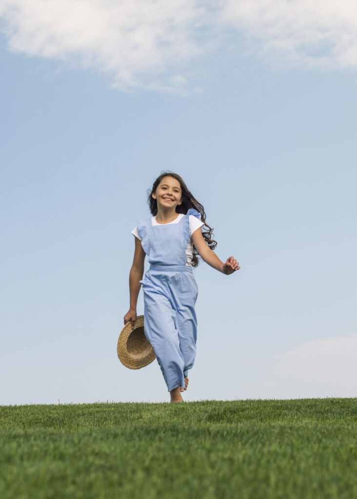 Healthy girl-walking-grass